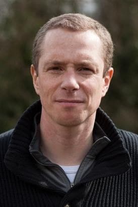 Nick Sireau, wearing a dark jacket, looking to camera outdoors